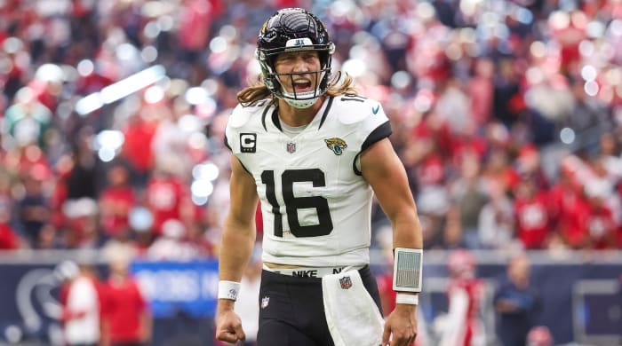 Jaguars quarterback Trevor Lawrence celebrates a touchdown during a game against the Texans.